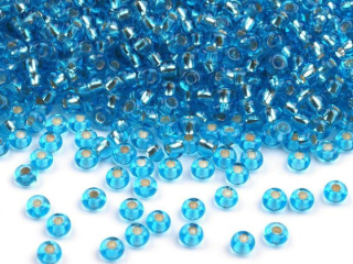 Rokajl PRECIOSA modrá tyrkys s průtahem > (10/0) Ø2,3mm (sáček 20g)